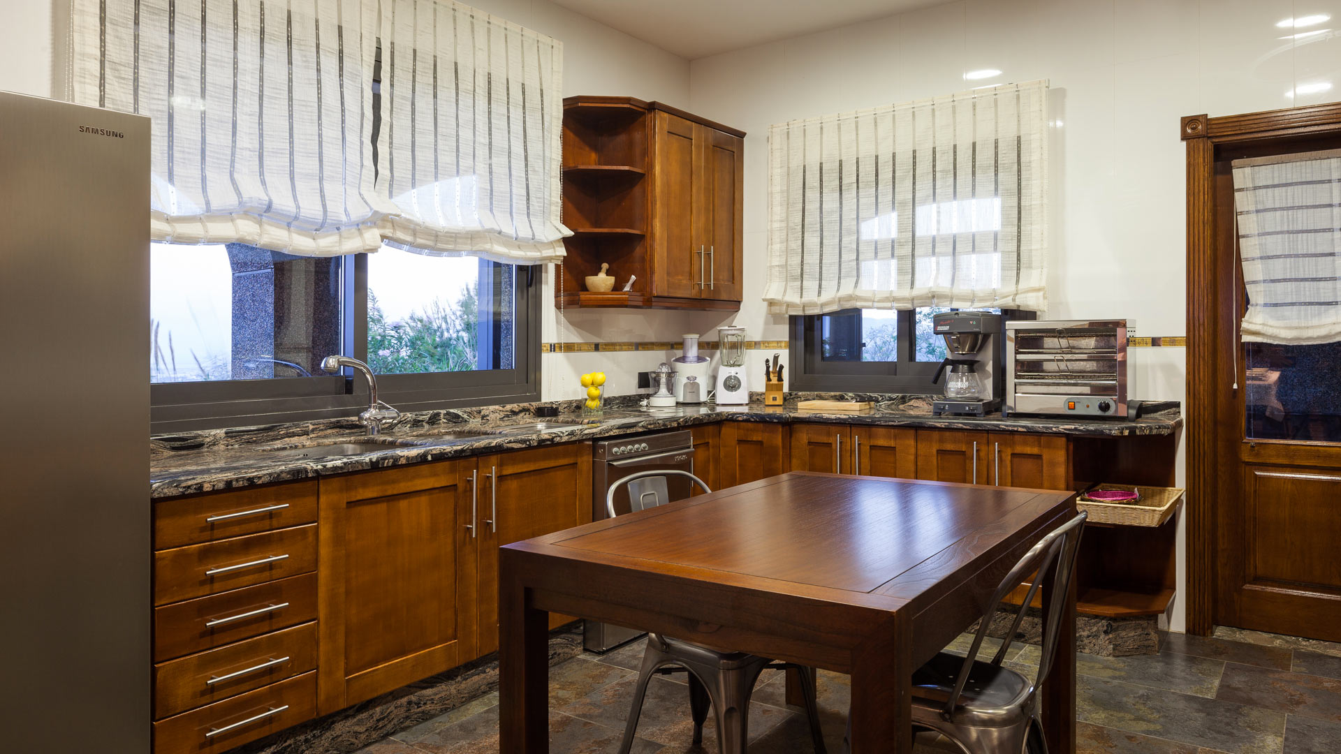 Villa Fountain Ibiza's kitchen with small breakfast table