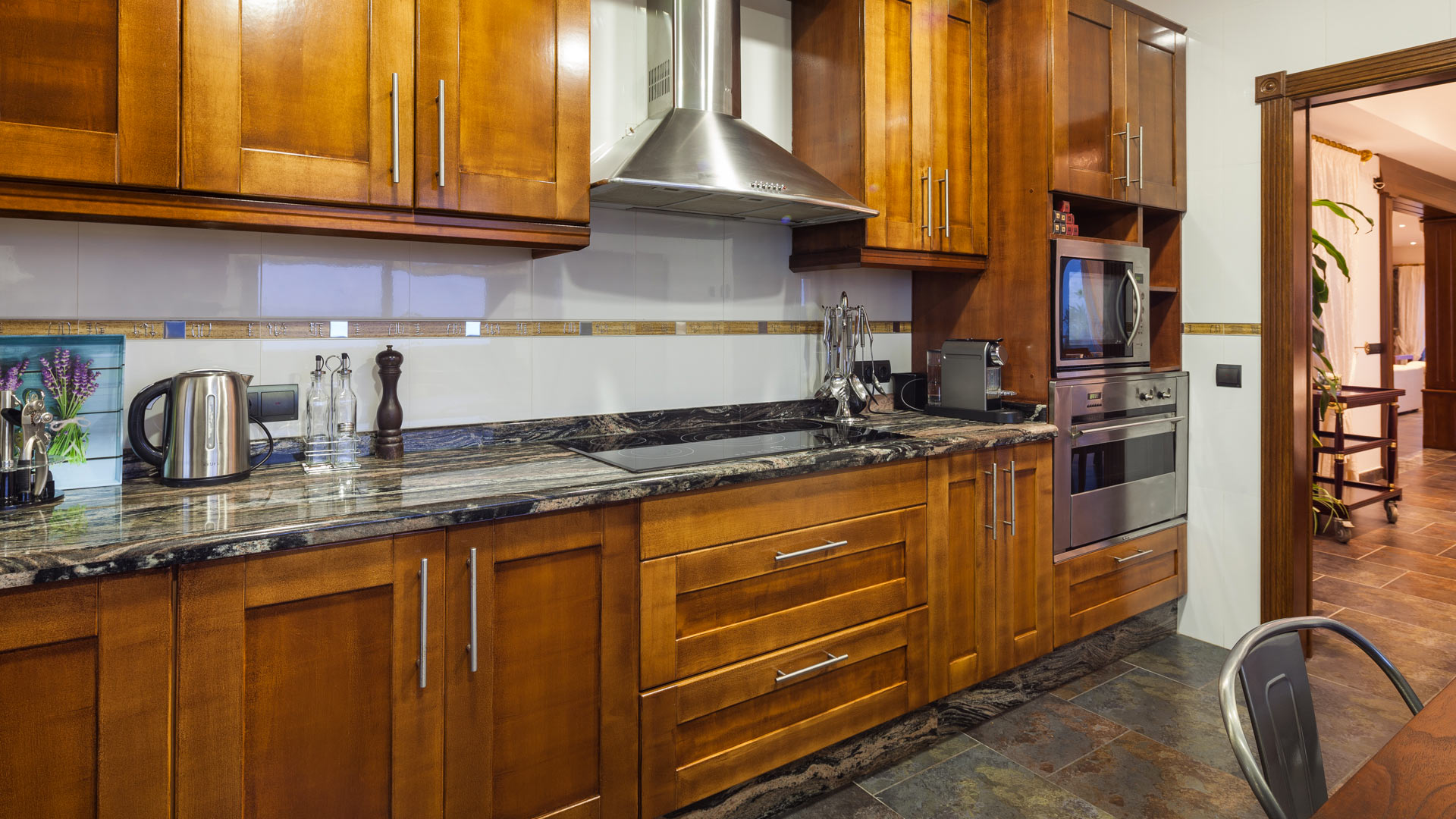 The dark wooden kitchen at Villa Fountain Ibiza