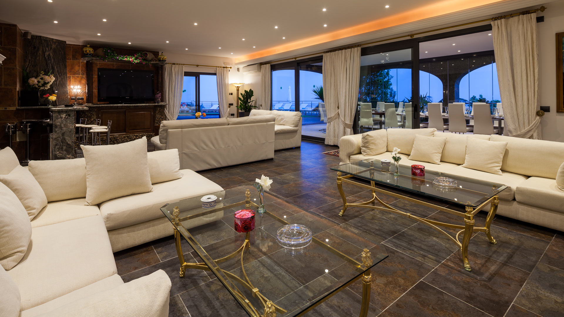 The grand living area at Villa Fountain Ibiza with plenty of comfy seating for families and groups