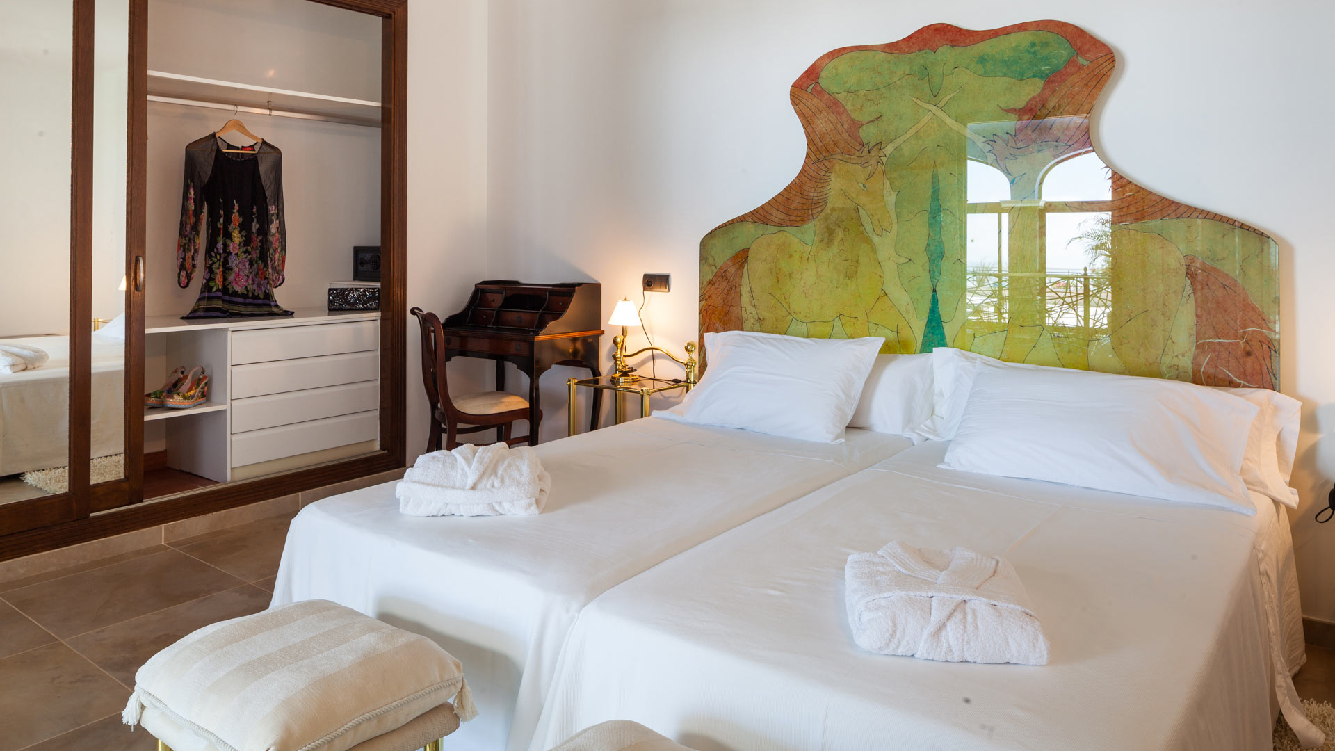 Close up for the bed and beautiful headboard at Villa Fountain Ibiza