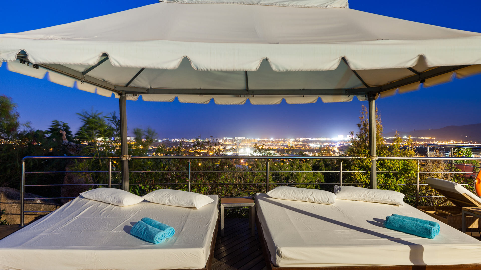 Close up of two days beds under a pergola at Villa Fountain Ibiza