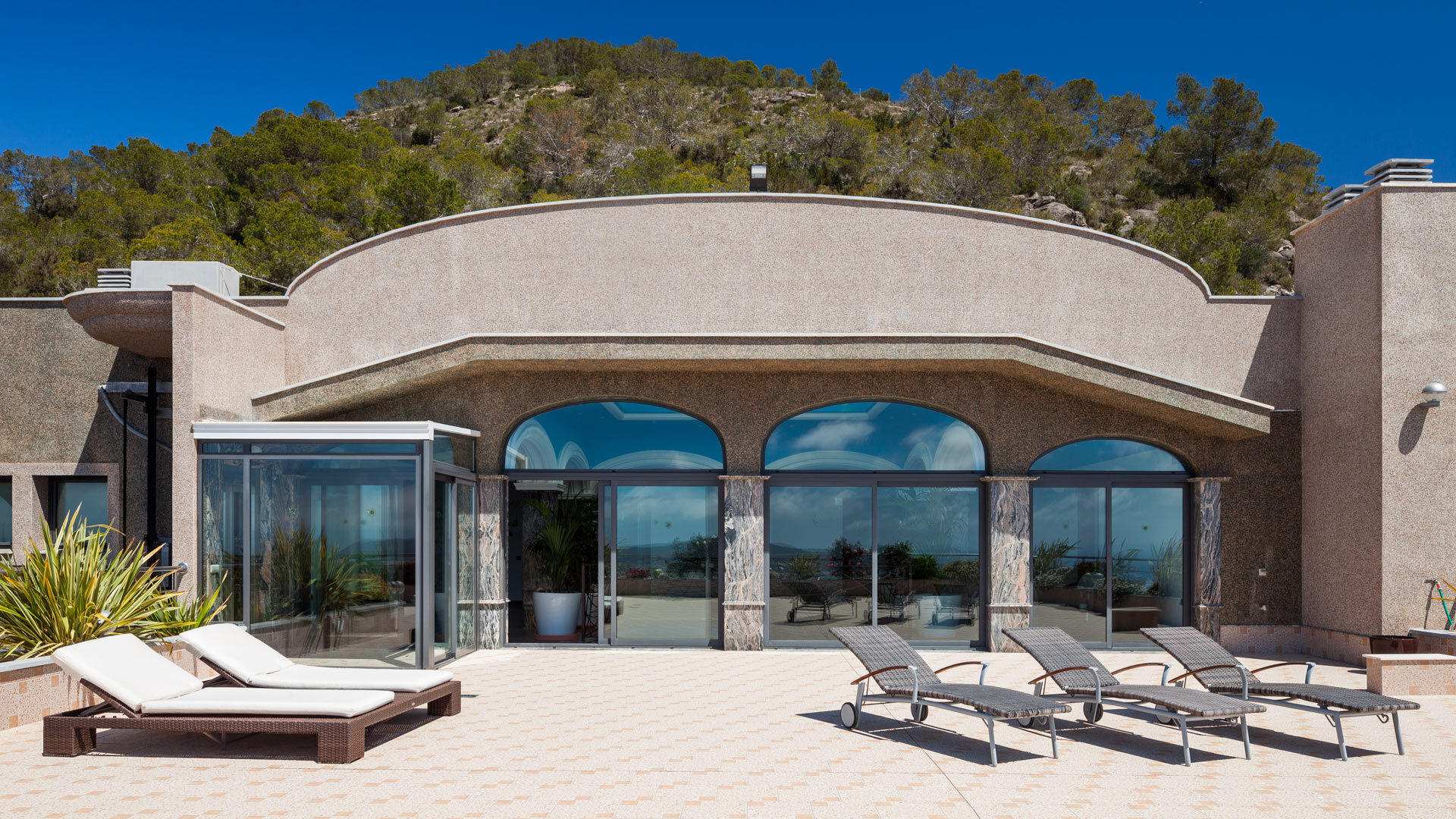 Sunloungers laid out under the Ibizan sun to enjoy at Villa Fountain Ibiza