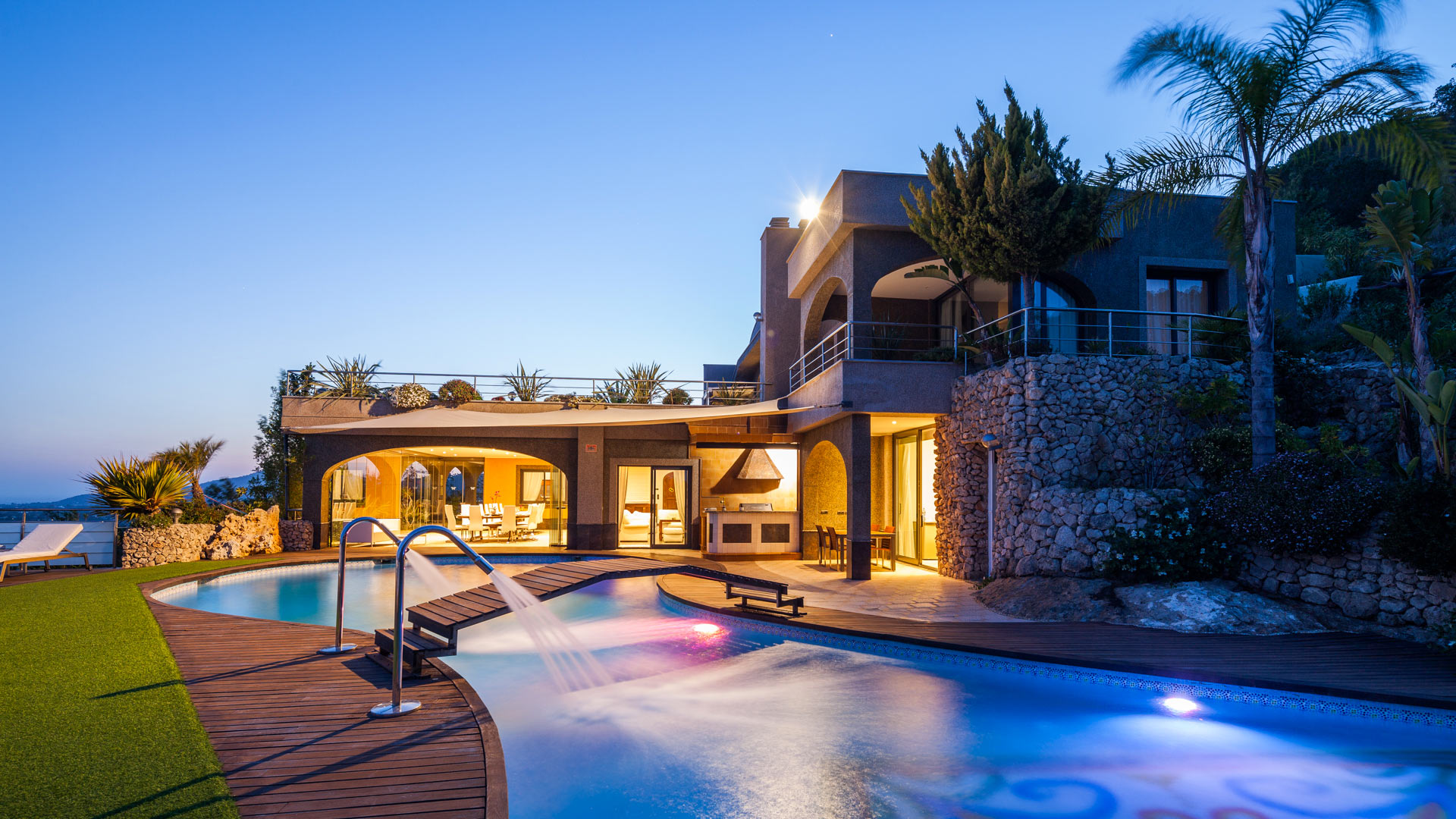 Dusk at Villa Fountain Ibiza with the pool lit up