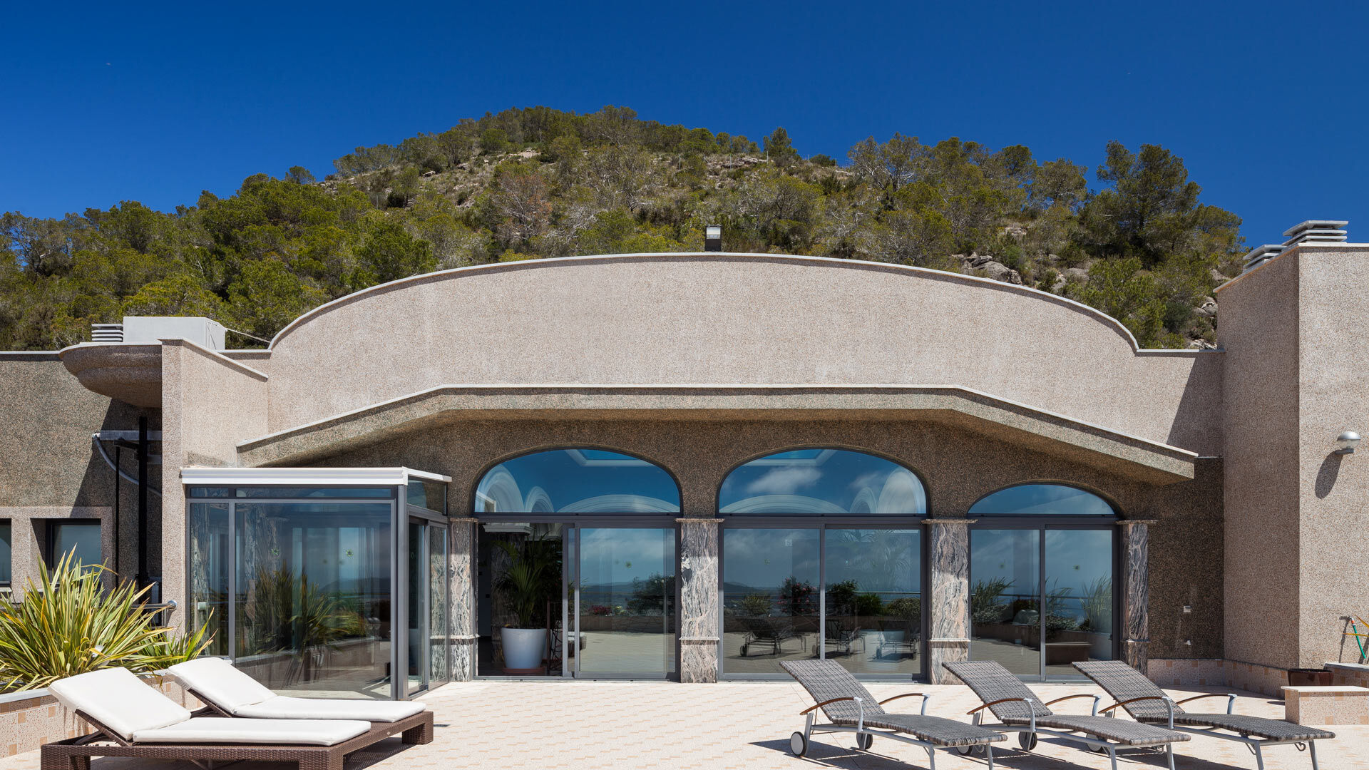 Luxury villa rental Villa Fountain Ibiza and the sunloungers to enjoy