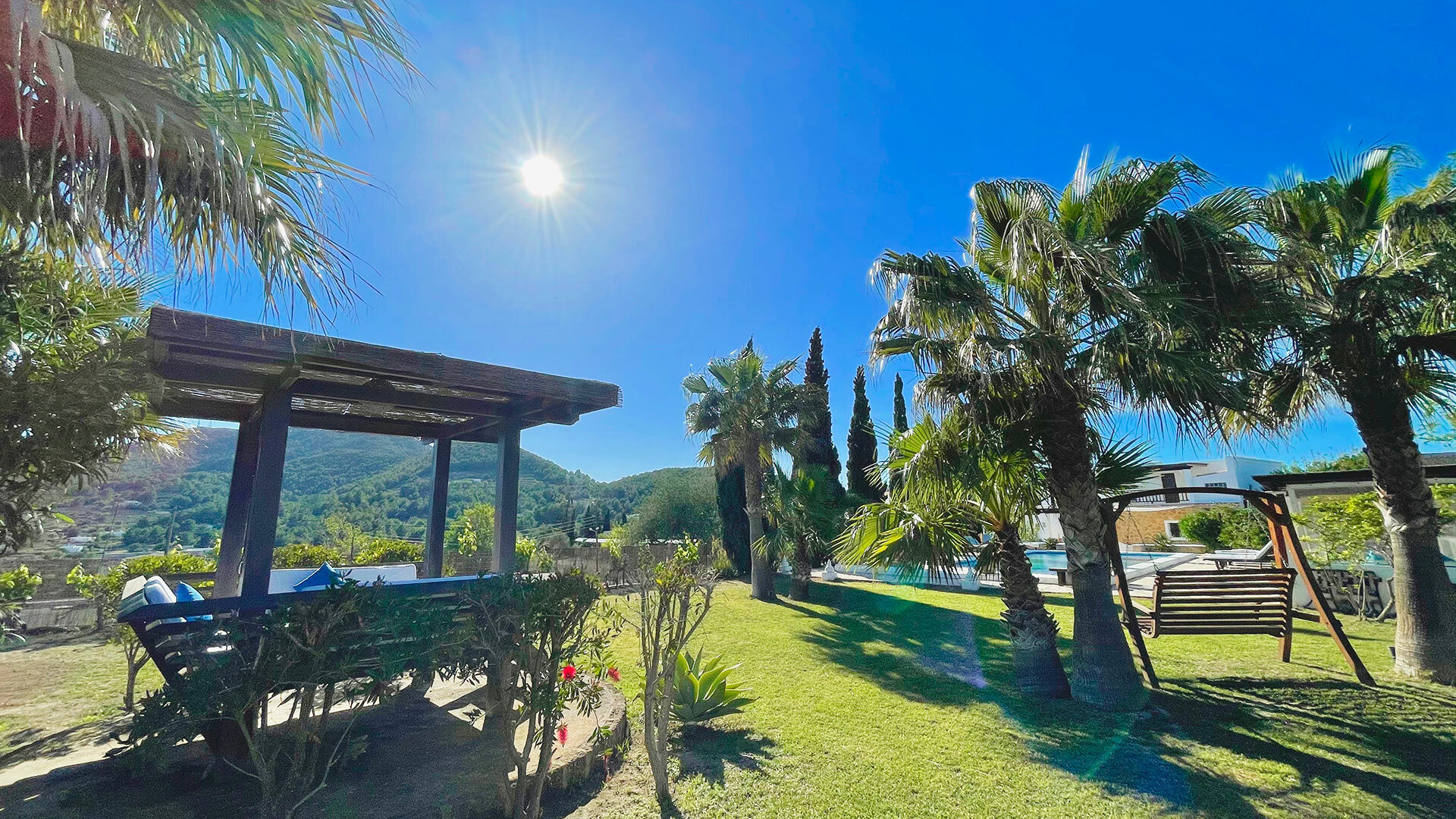 The gardens of Villa Torre Pau in Ibiza and the beautiful sun beating down