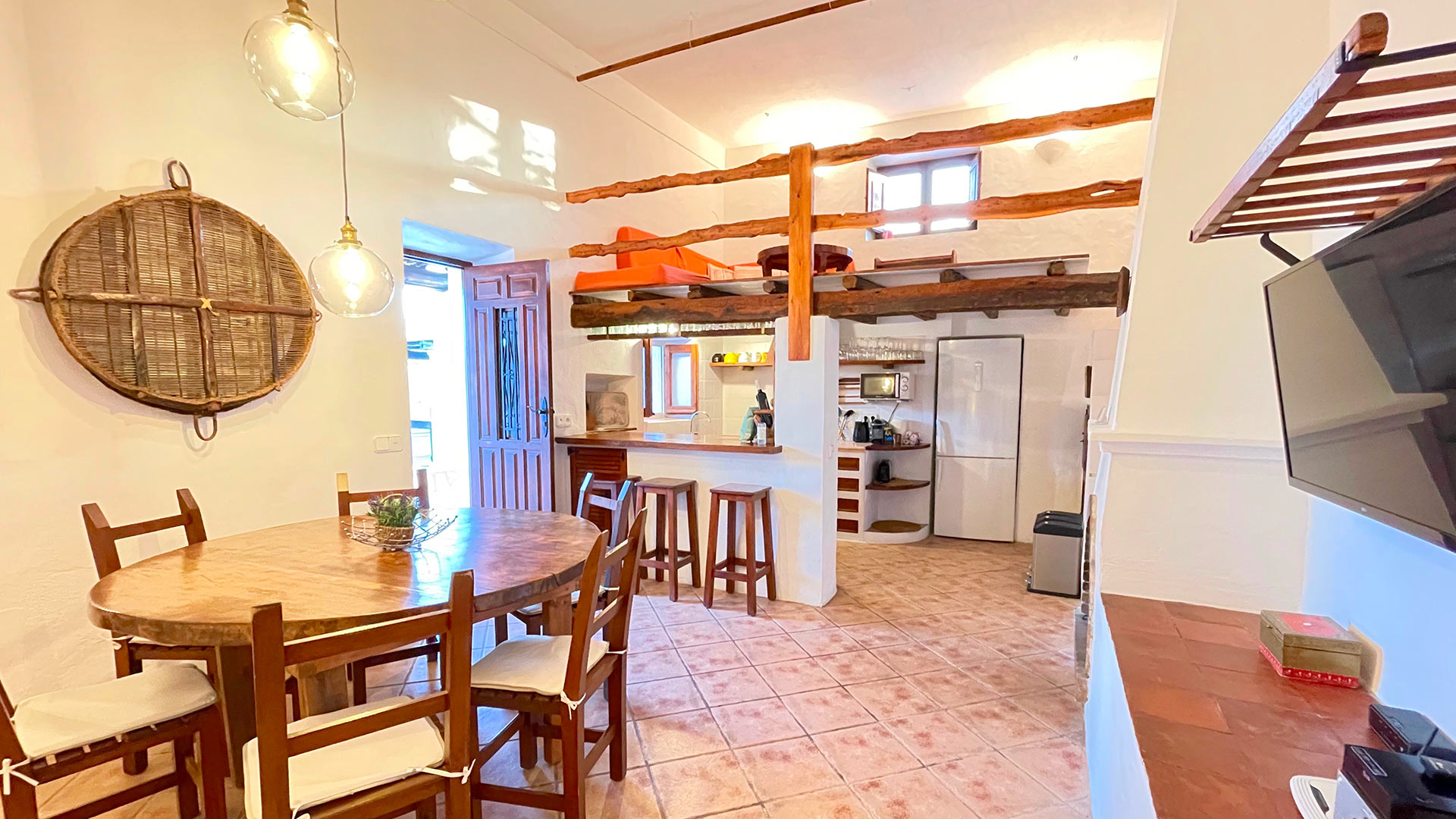 Dining space the beautifully leads into the kitchen at Villa Torre Pau in Ibiza