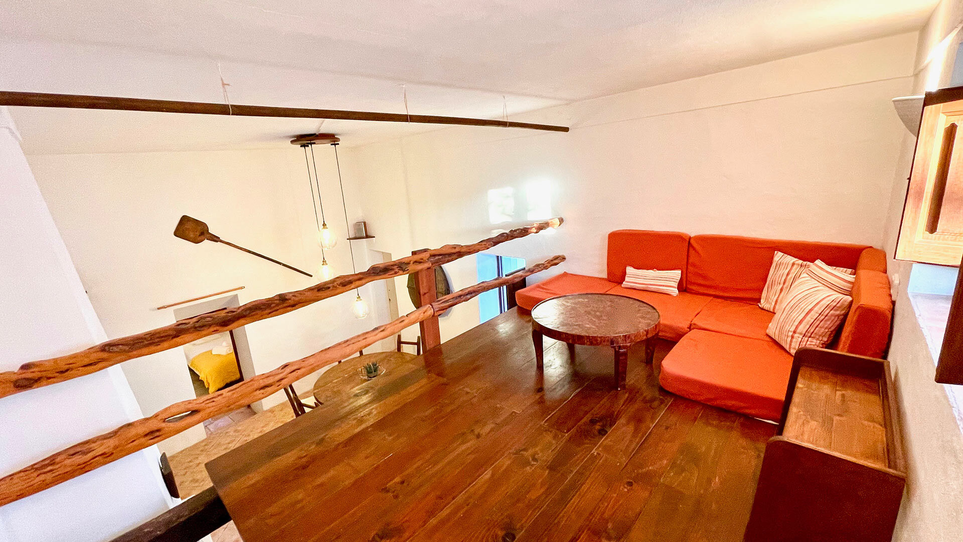 A small mezzanine living space with comfortable seating at Villa Torre Pau in Ibiza