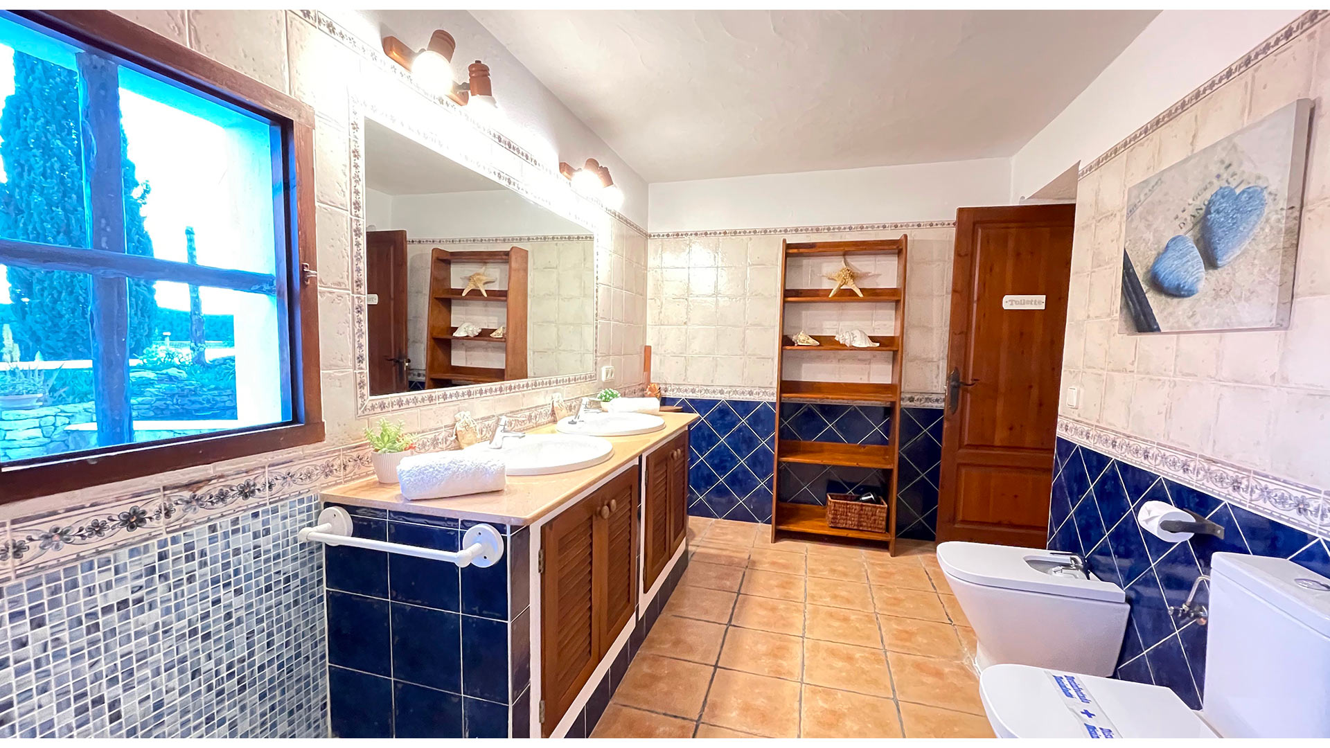 Blue and white tilled bathroom in Villa Torre Pau in Ibiza