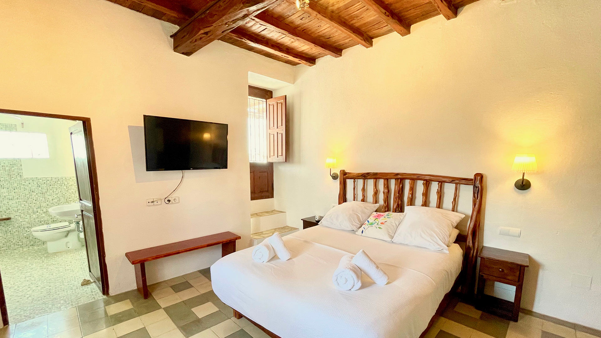 One of the large bedrooms in Villa Torre Pau in Ibiza with an ensuite bathroom 