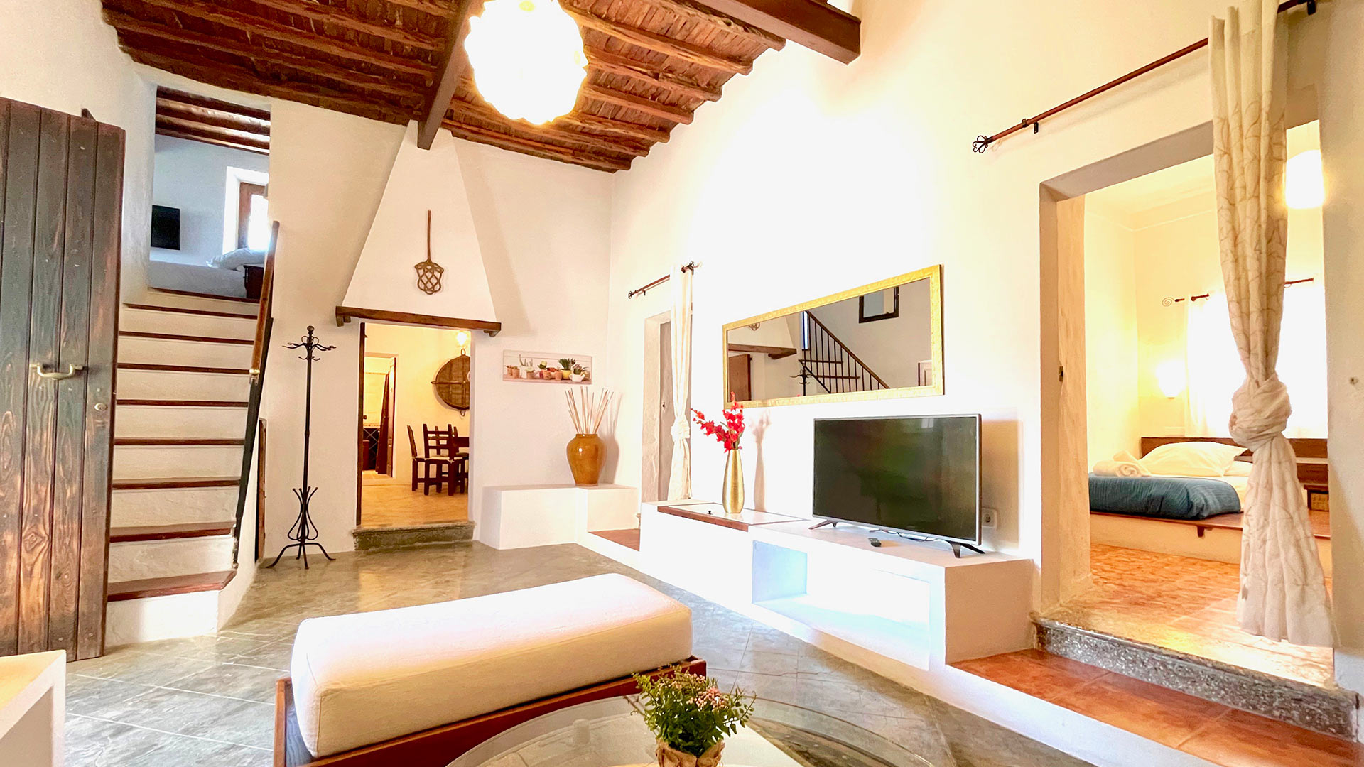 The main living area at Bluemoon's Villa Torre Pau with wooden touches throughout