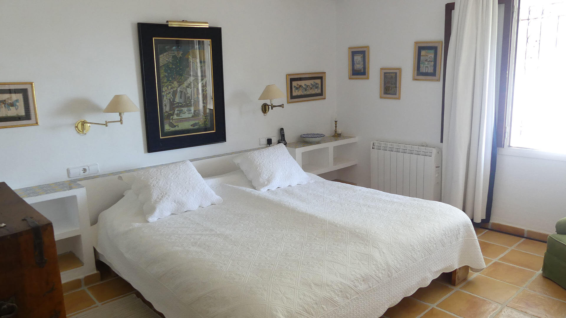 One of the larger bedrooms in Villa Trillo in Ibiza with plenty of classic Ibizan features