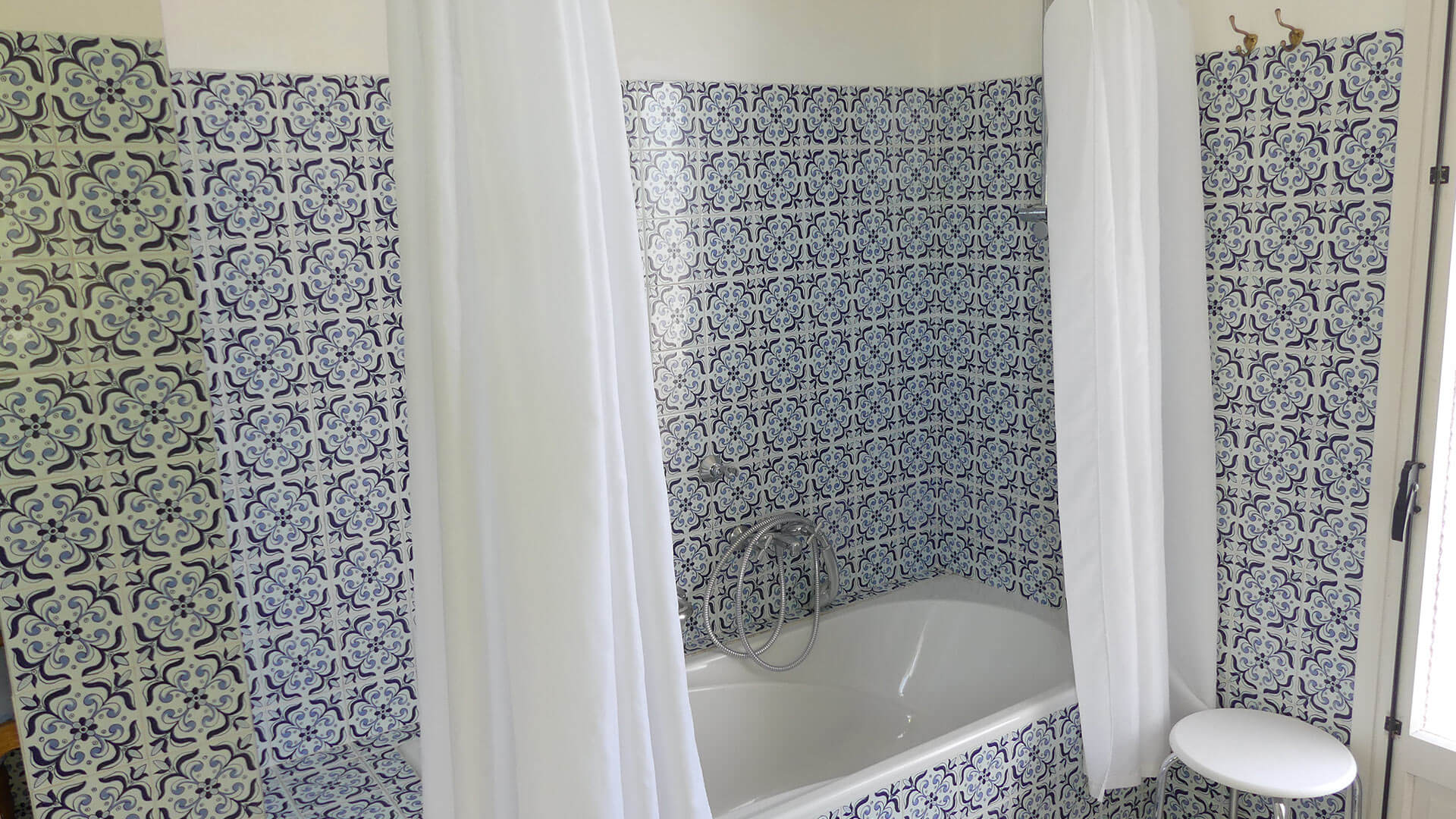 One of the beautifully blue and white tiled bathrooms in Villa Trillo in Ibiza