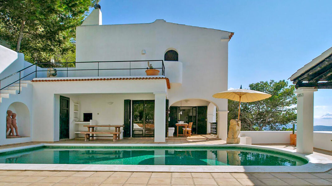 Back exterior view of Villa Trillo in Ibiza with the gorgeous swimming pool