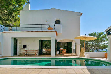 Back exterior view of Villa Trillo in Ibiza with the gorgeous swimming pool