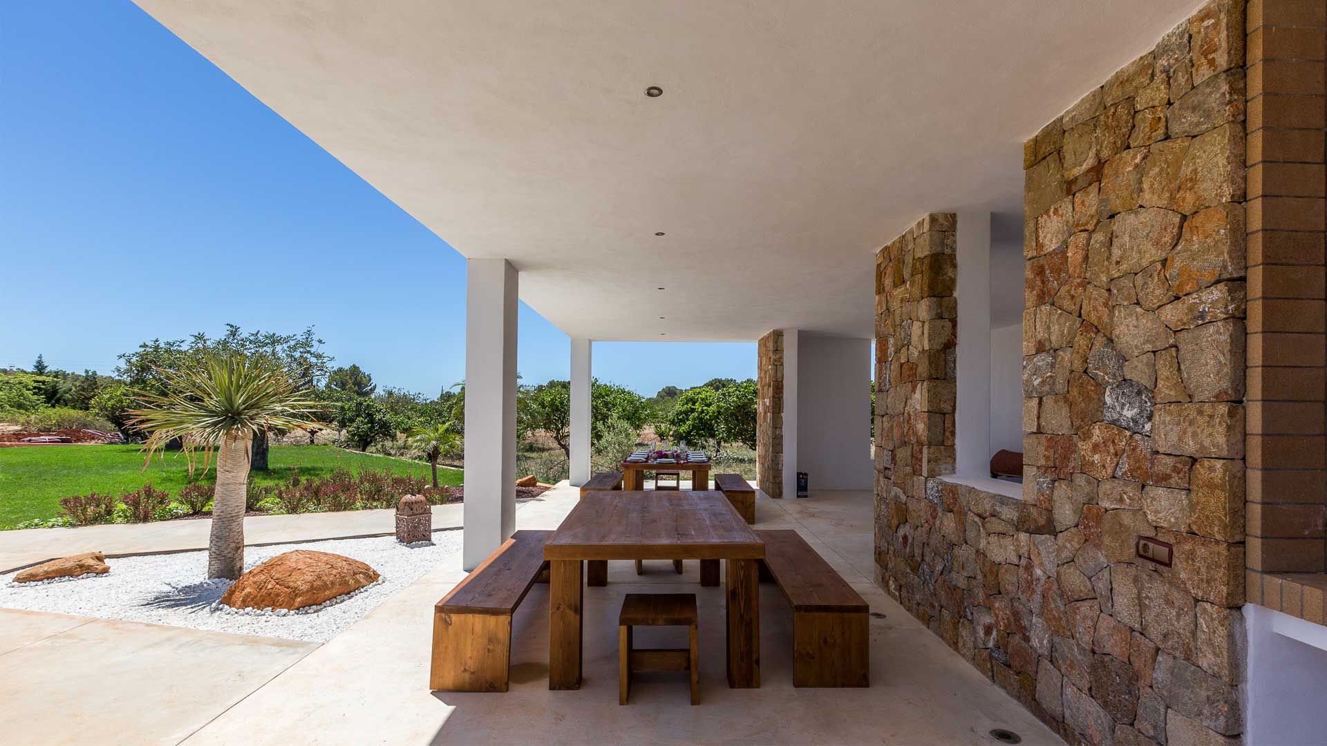 Shaded long dining bench at Villa Es Canar in Ibiza