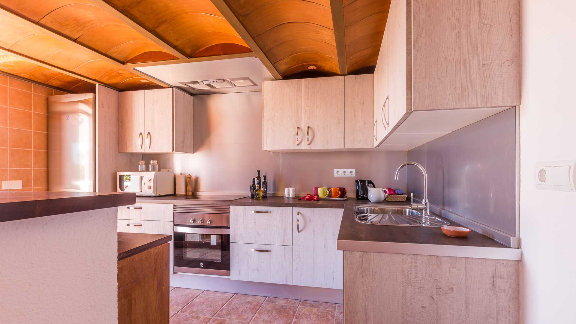 Beautiful kitchen at Villa Es Canar in Ibiza with modern appliances 