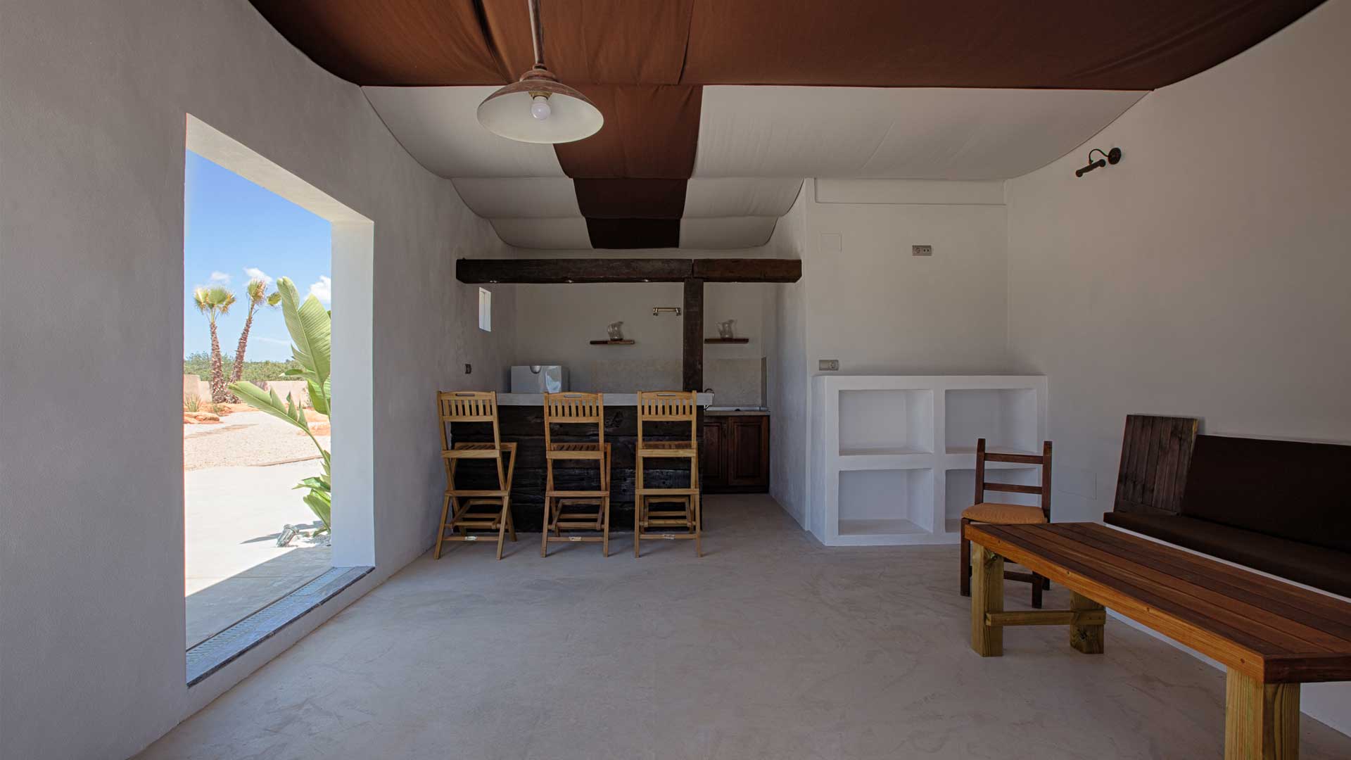 The shaded outdoor dining area at Villa Es Canar in Ibiza