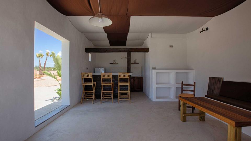 The shaded outdoor dining area at Villa Es Canar in Ibiza