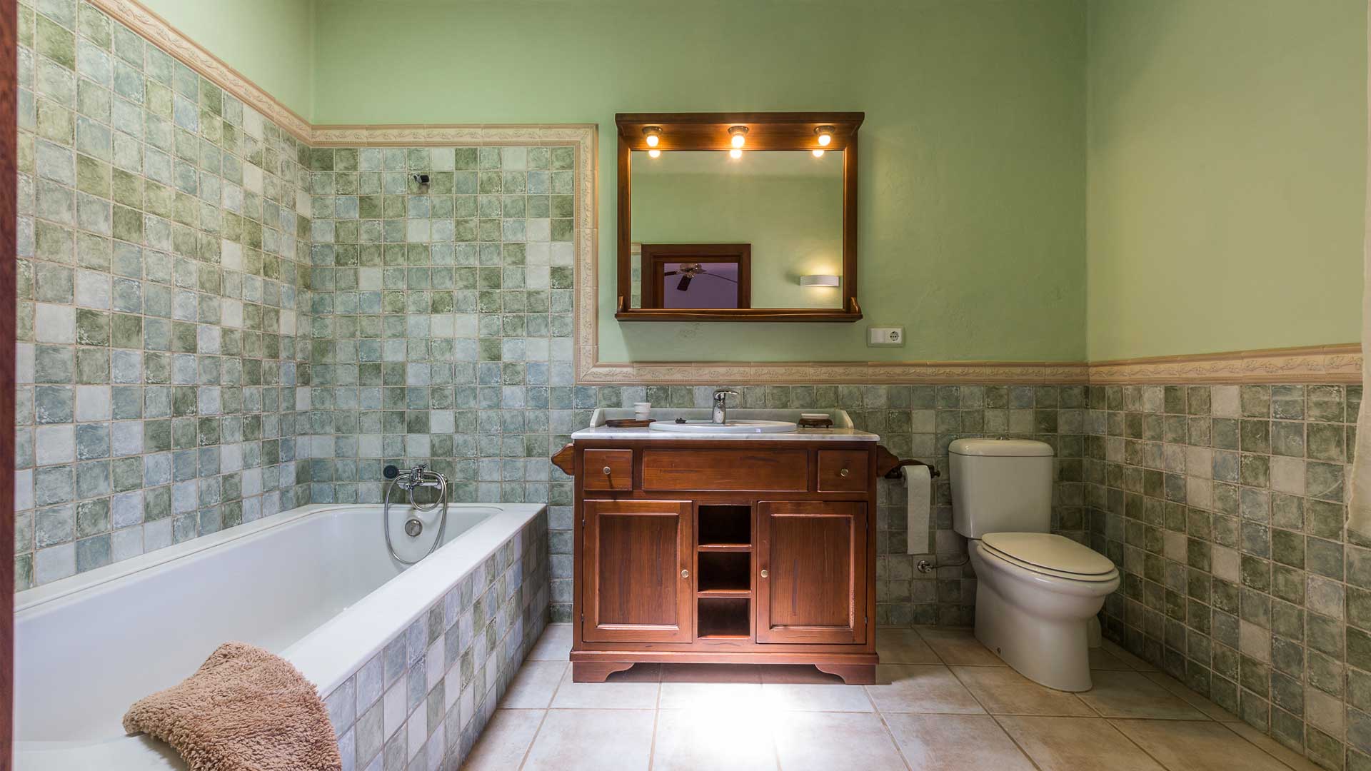 Green featured bathroom at Villa Es Canar in Ibiza
