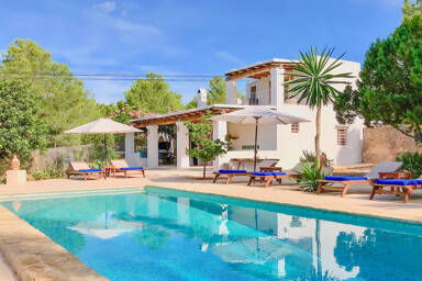 Villa Garroba and the light blue swimming pool in luxury Ibiza villa rental