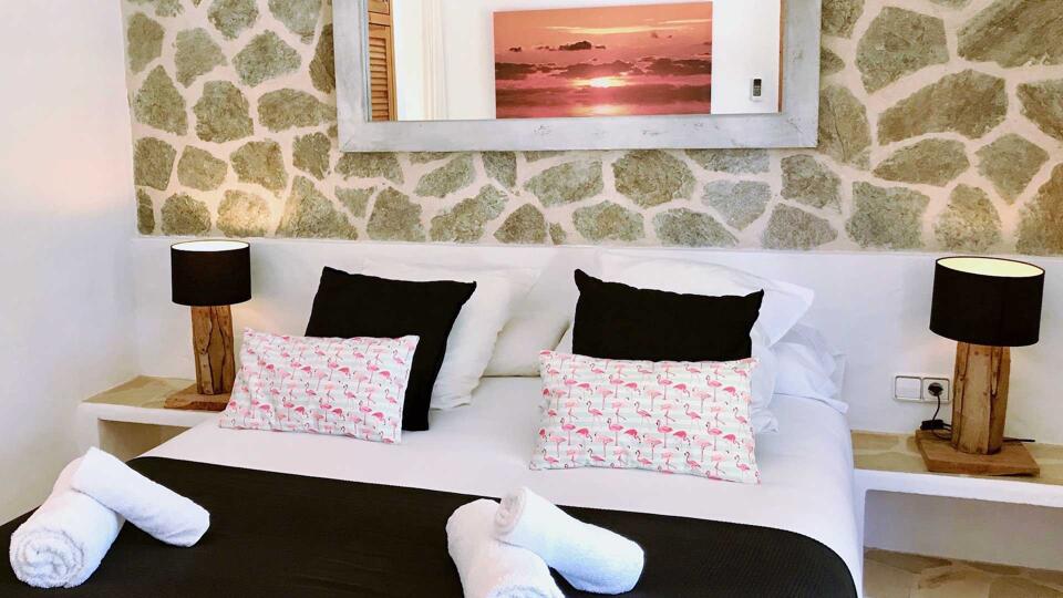 One of the bedrooms in Villa Garroba in Ibiza a luxury rental villa