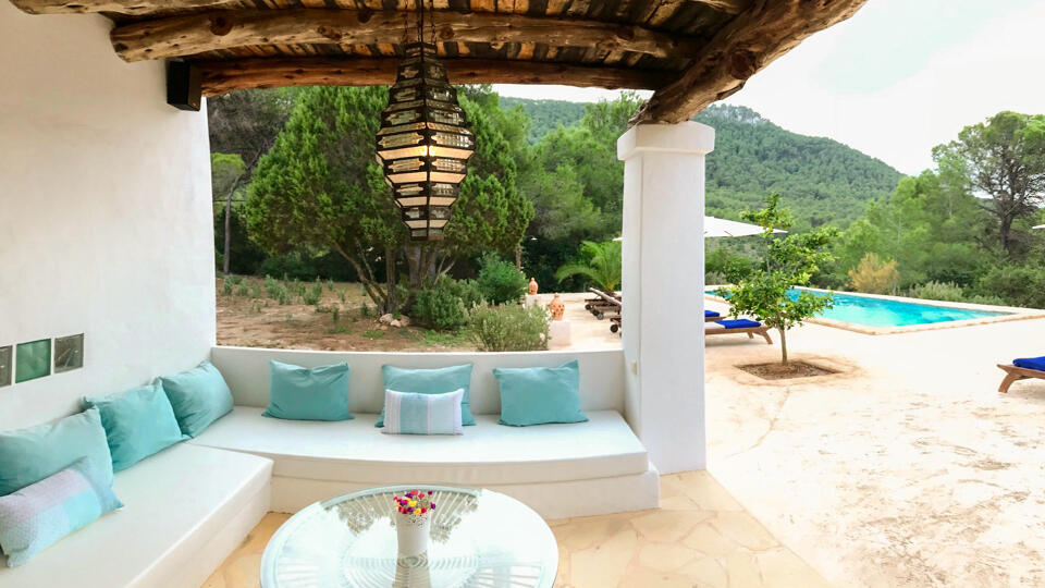 Pergola at Villa Garroba in Ibiza with plenty of seating for friends and family to enjoy