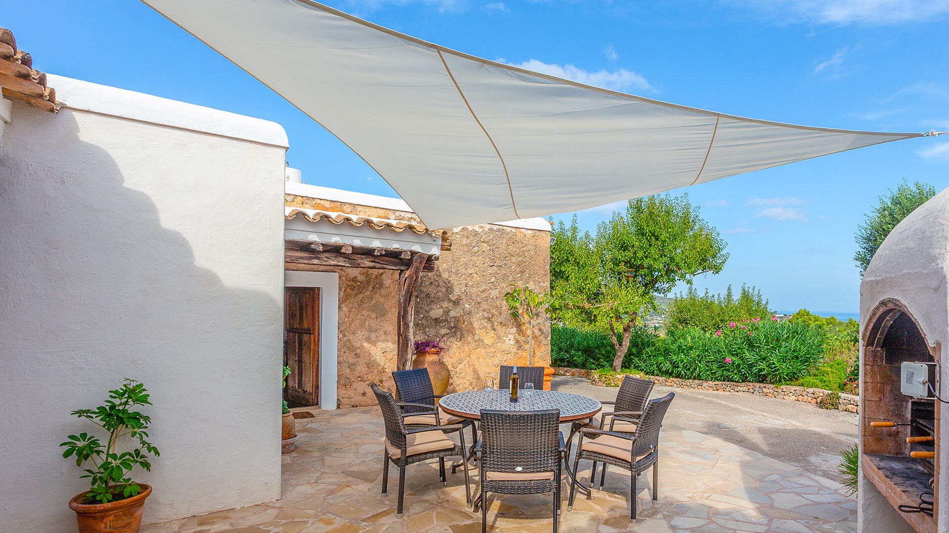 Shaded alfresco dining area in Villa Guerxo in Ibiza