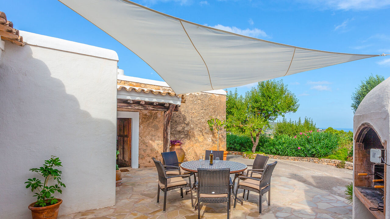 Shaded alfresco dining area in Villa Guerxo in Ibiza