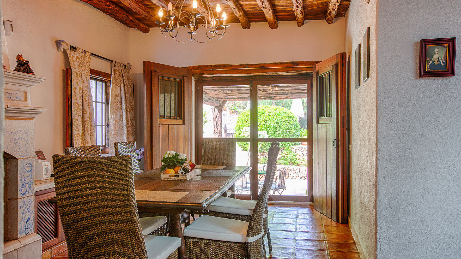 The dining area with a view through the patio door at Villa Guerxo in Ibiza
