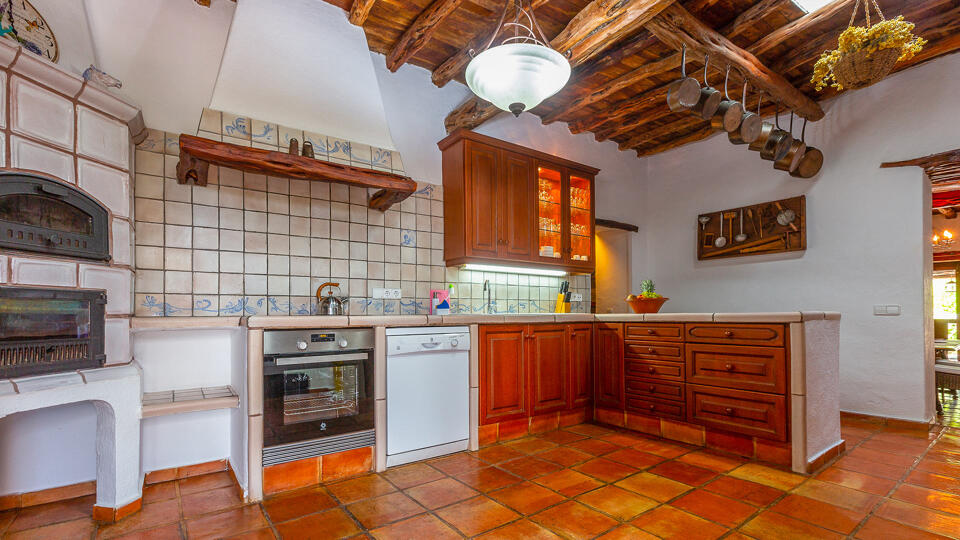 A classic Ibizan style kitchen in Villa Guerxo with modern appliances