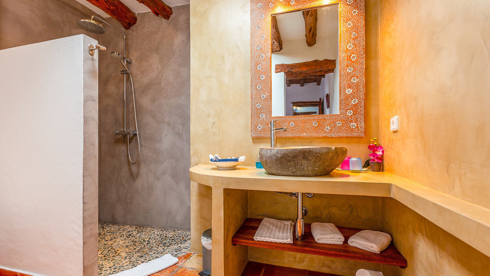 Wooden accents in the spacious bathroom in Villa Guerxo in Ibiza