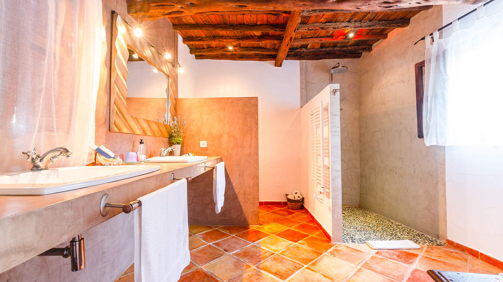 Spacious bathroom bathed in natural light in Villa Guerxo in Ibiza