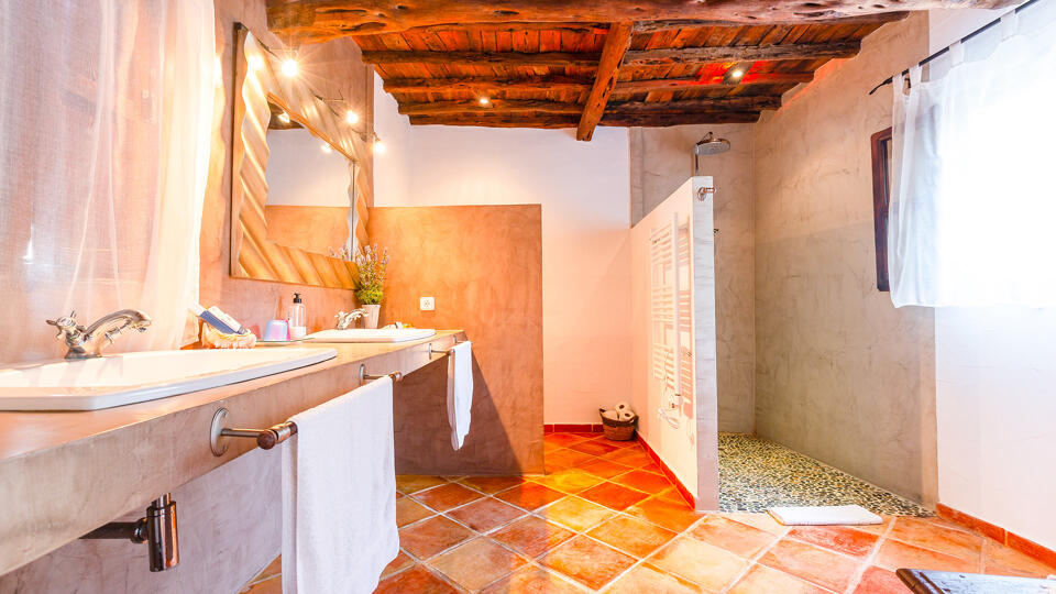 Spacious bathroom bathed in natural light in Villa Guerxo in Ibiza