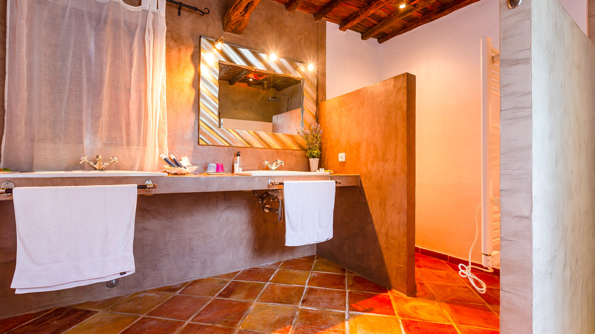 Vanity mirror in the bathroom at Villa Guerxo in Ibiza