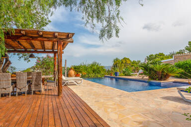The pergola and infinity pool at Villa Guerxo in Ibiza available for rental with Bluemoon