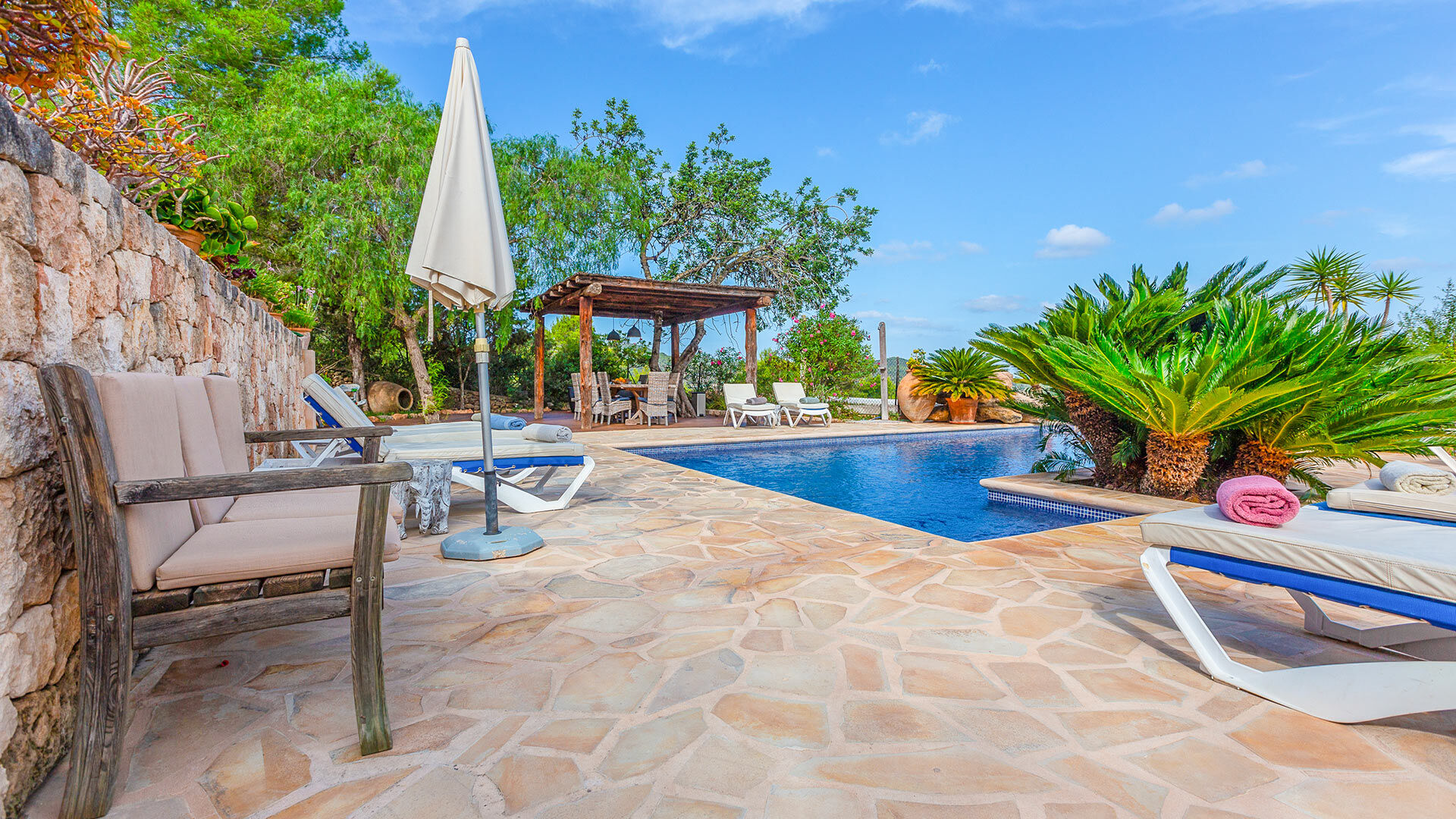 Poolside at Villa Guerxo in Ibiza the luxury villa rental from Bluemoon