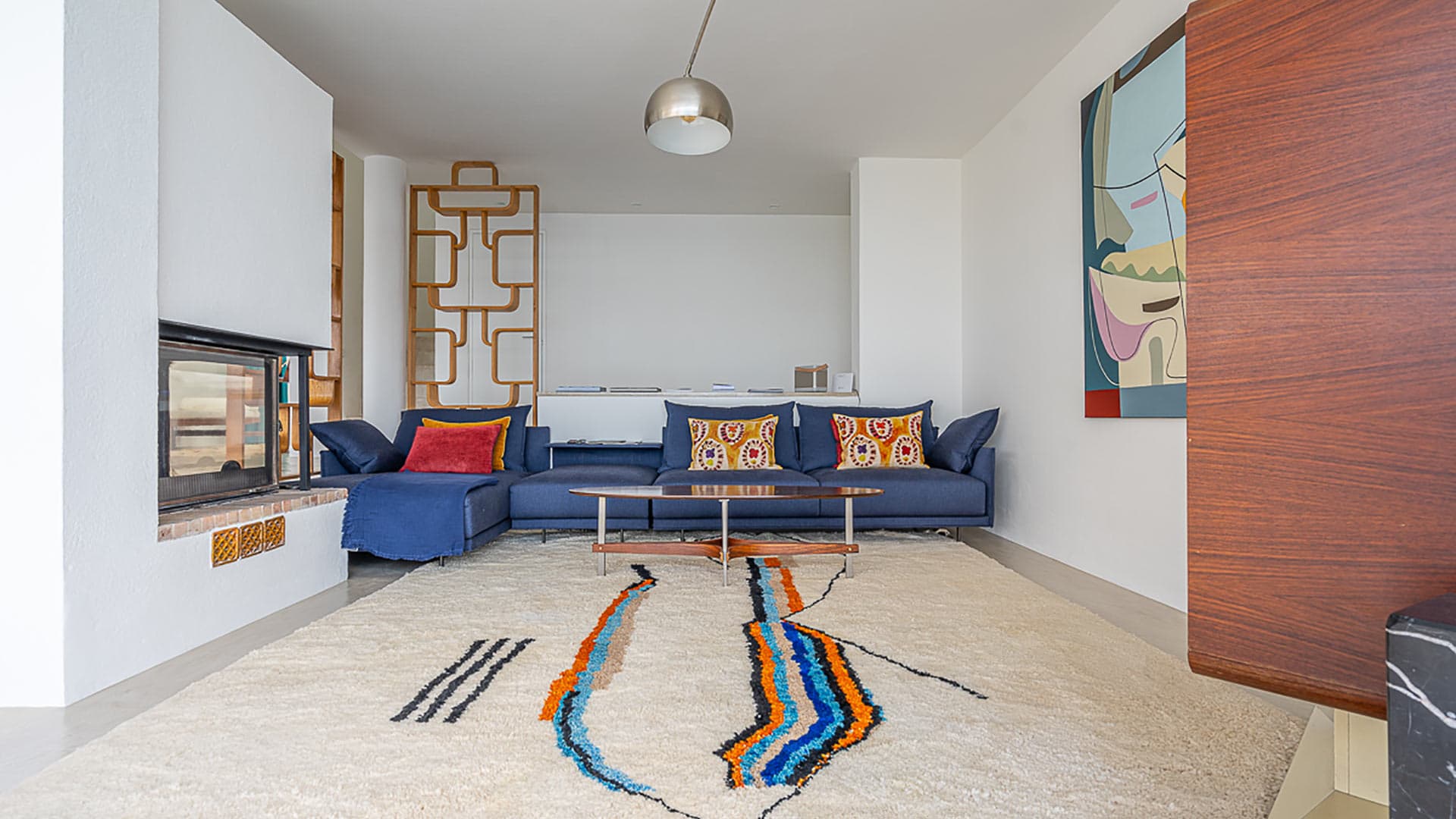 Living space at Villa Orizonia in Ibiza with a plush sofa and warm tones