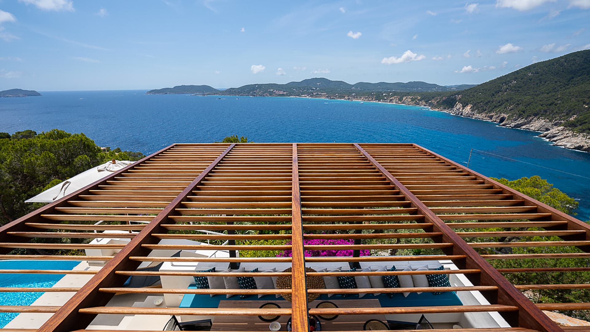 Bedroom view from Villa Orizonia in Ibiza overlooking the Mediterranean Sea and the top of the pergola