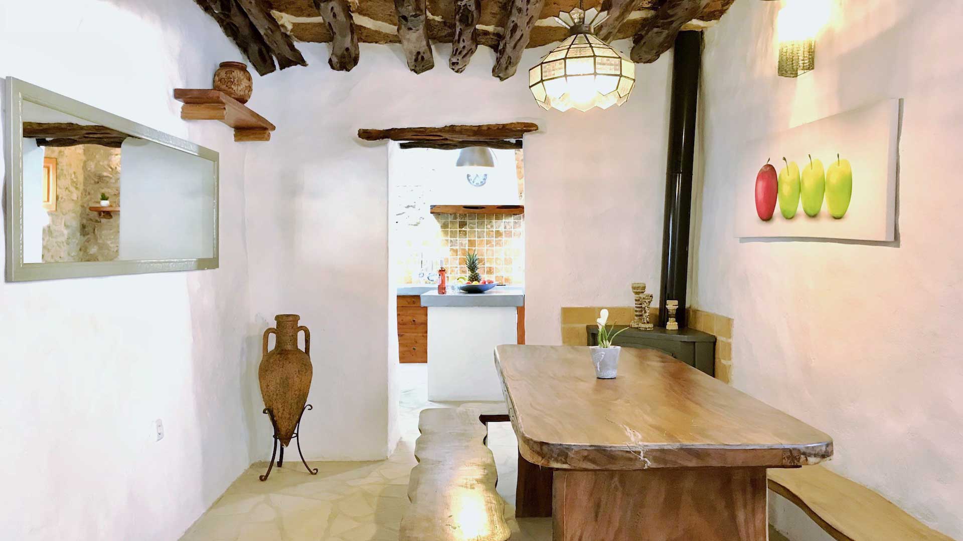 Dining area at Villa Payesa with a beautiful bench ideal for large friend groups and families