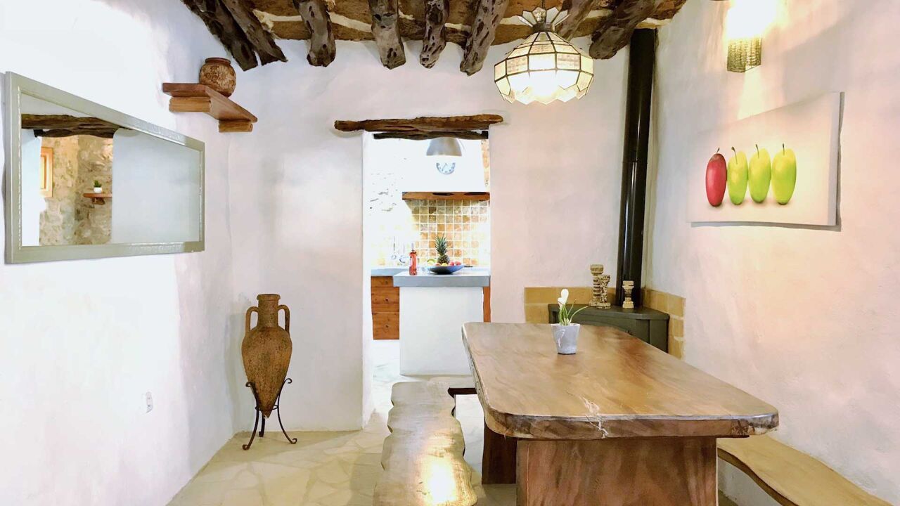 Dining area at Villa Payesa with a beautiful bench ideal for large friend groups and families