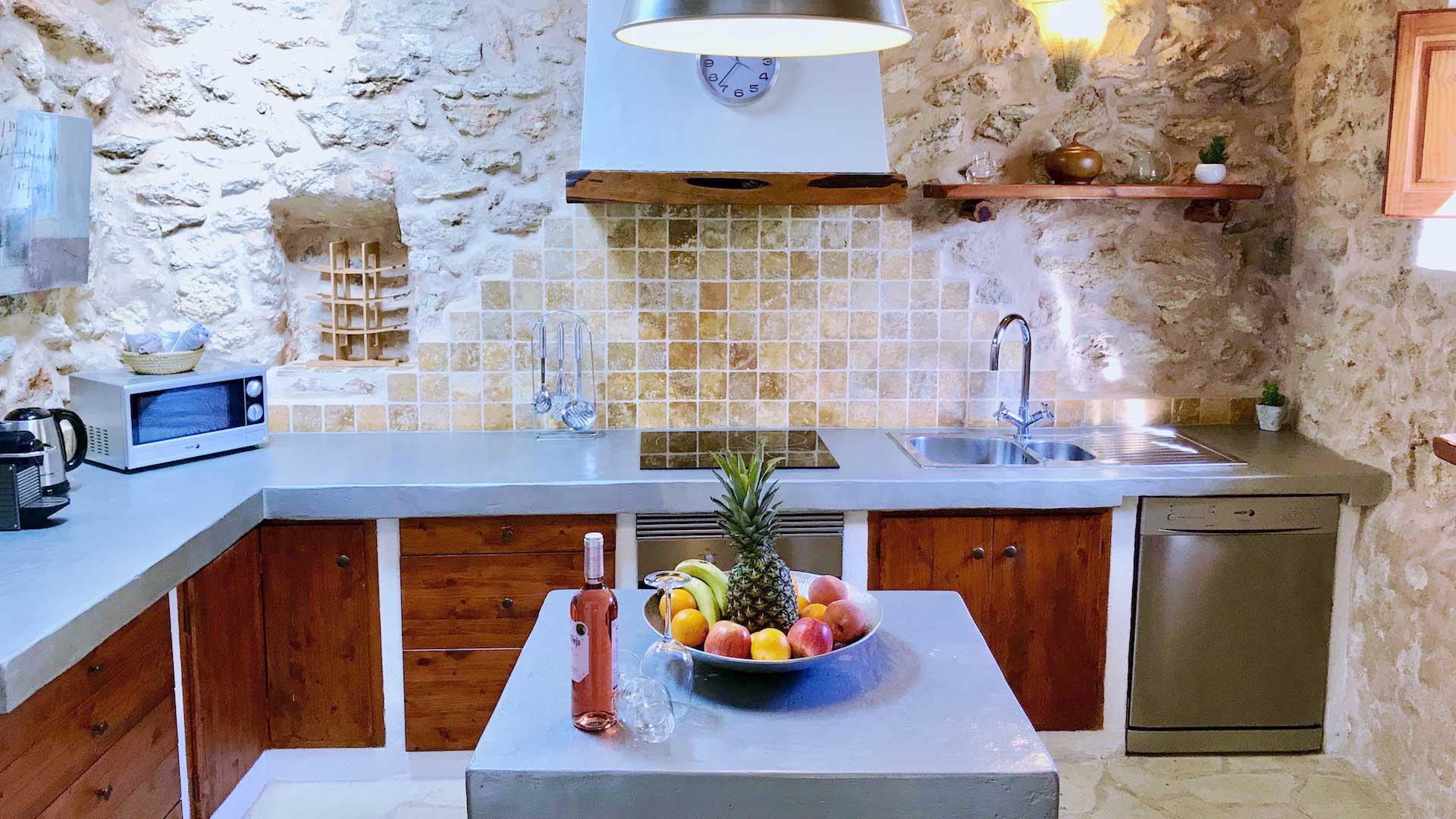 Villa Payesa's tiled and stone kitchen filled with modern appliances