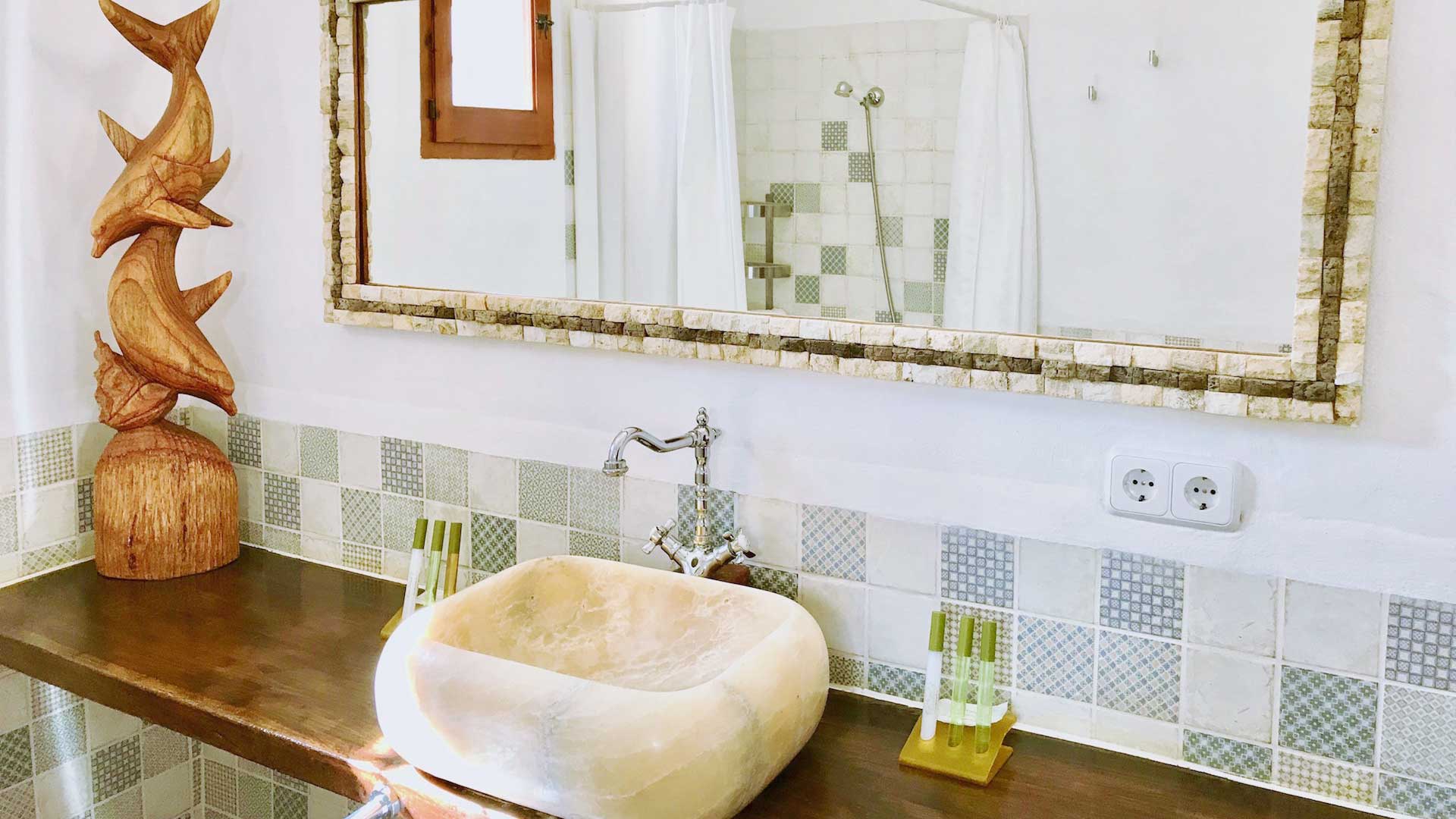 Large bathroom mirror over the wash basin at Villa Payesa in Ibiza