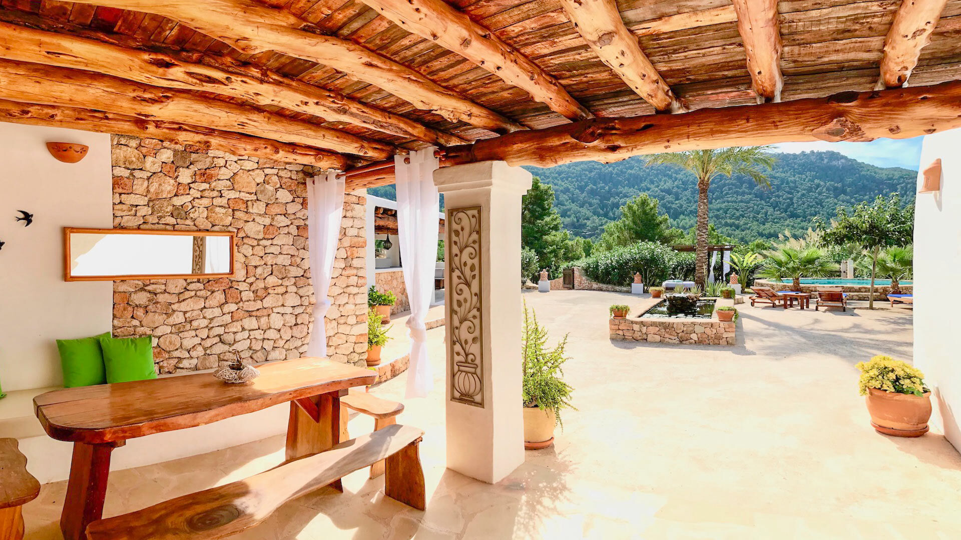 Pergola with a bench underneath at Villa Payesa perfect for alfresco meals
