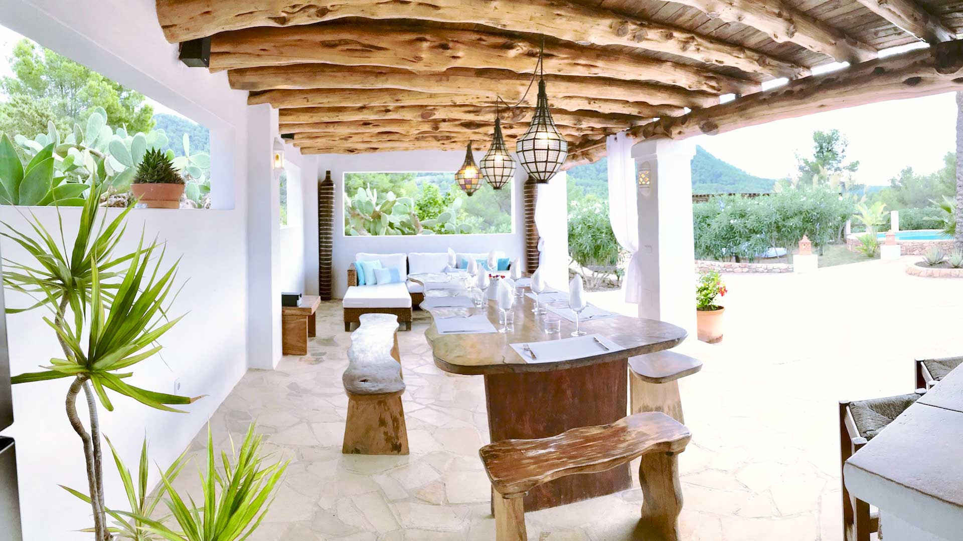 Pergola in Villa Payesa with a long dining bench for alfresco dining in Ibiza