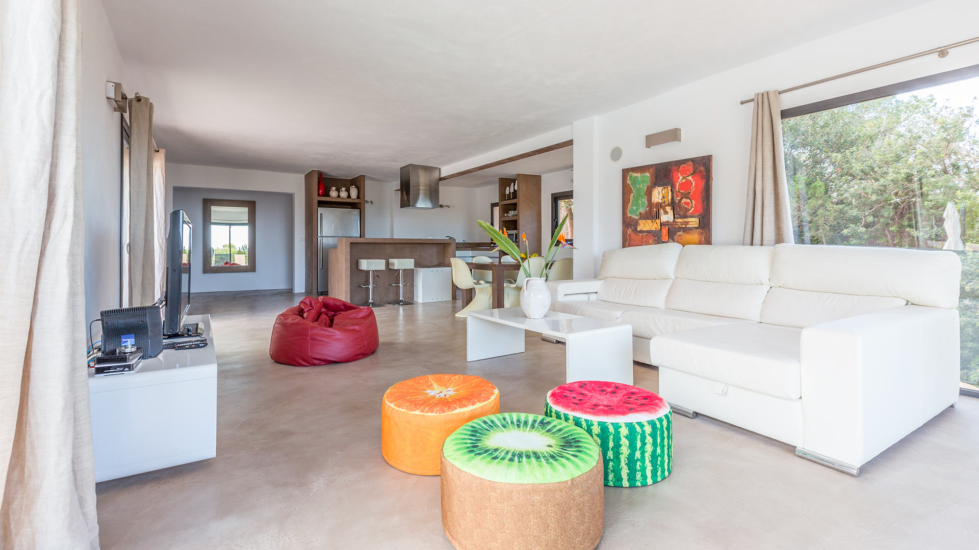 Living area at the luxury Villa Tiramar in Ibiza with kiwi, orange and watermelon cushions