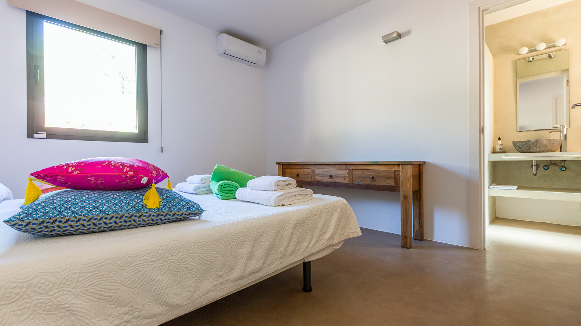 Ensuite bedroom in Villa Tiramar in Ibiza with colourful pops of colour