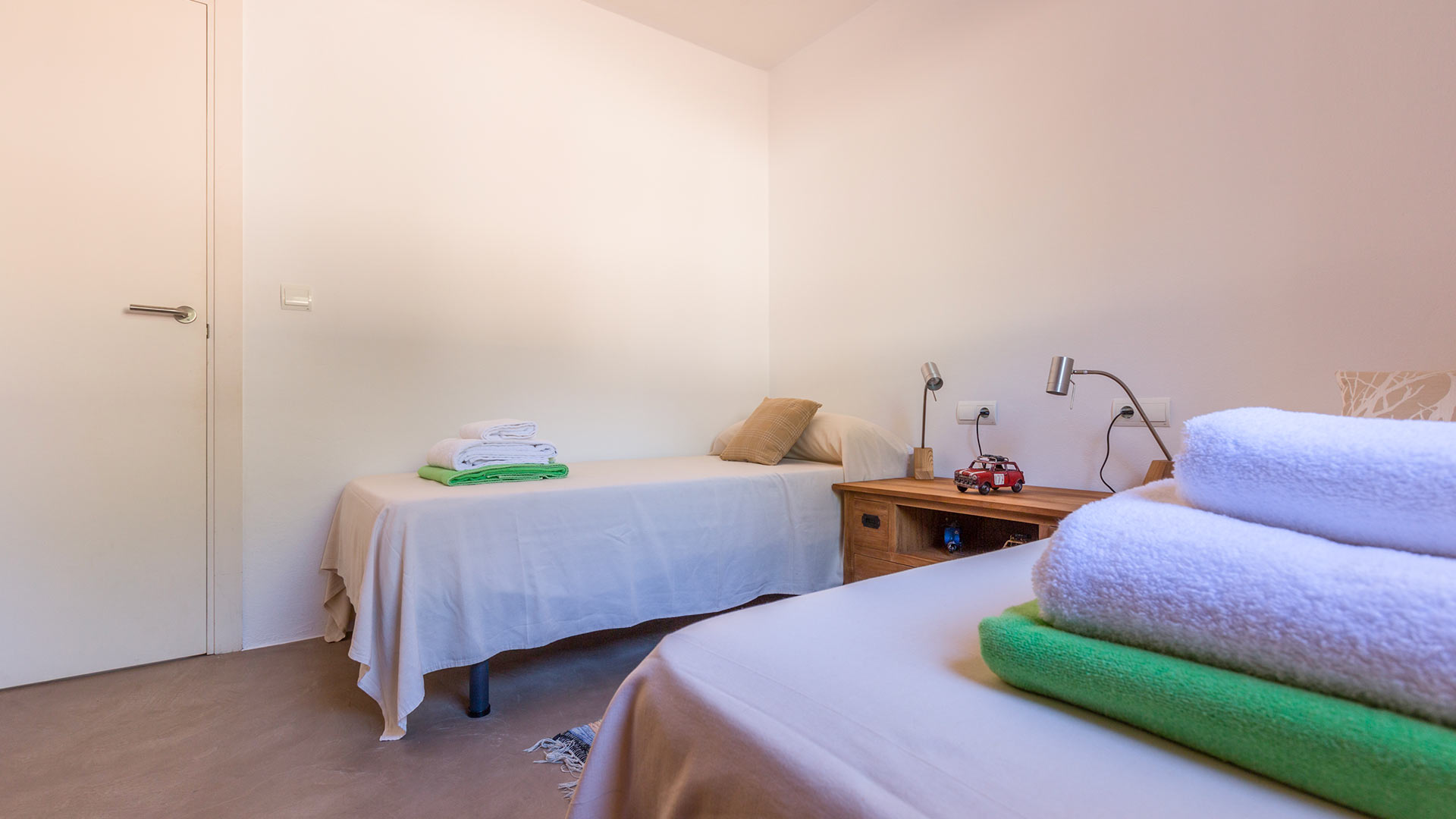 Twin room at Villa Tiramar in Ibiza with well presented linens