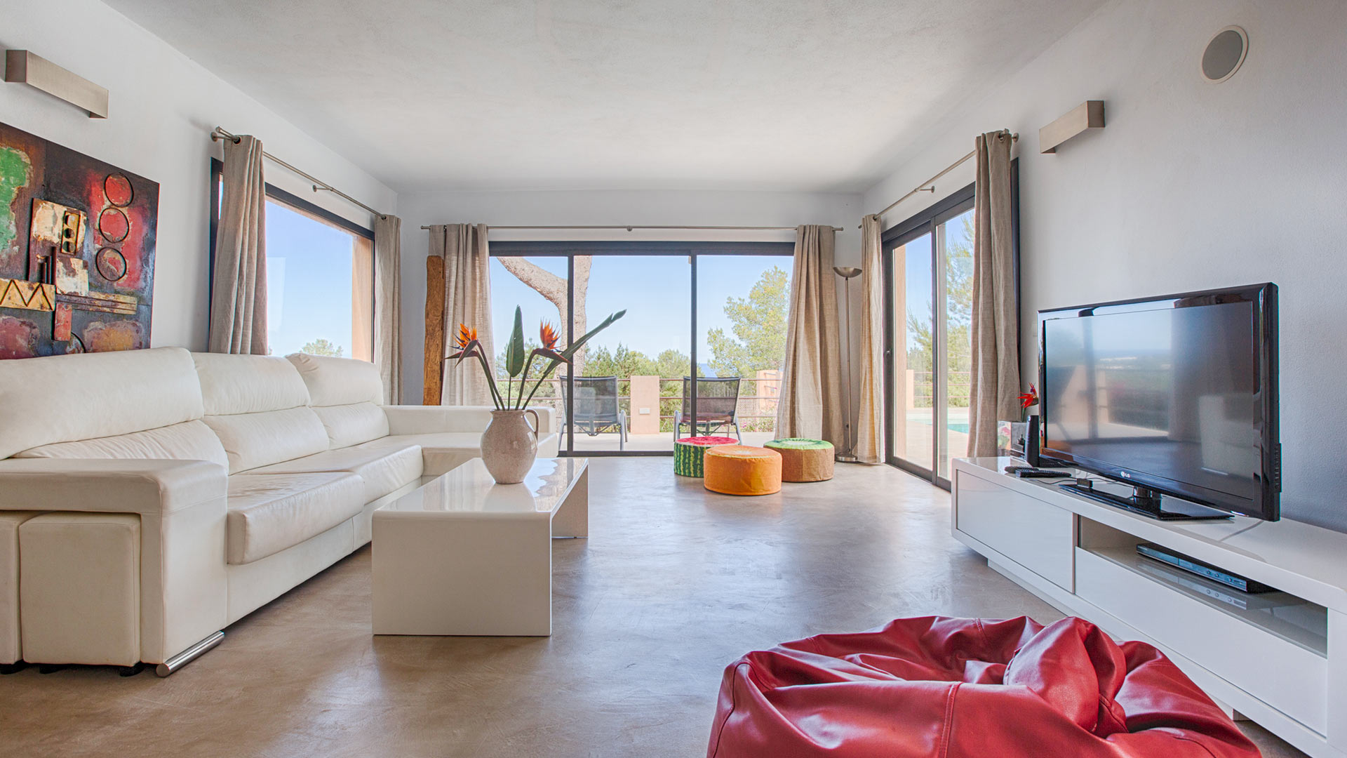 Well presented living space with large windows at Villa Tiramar in Ibiza