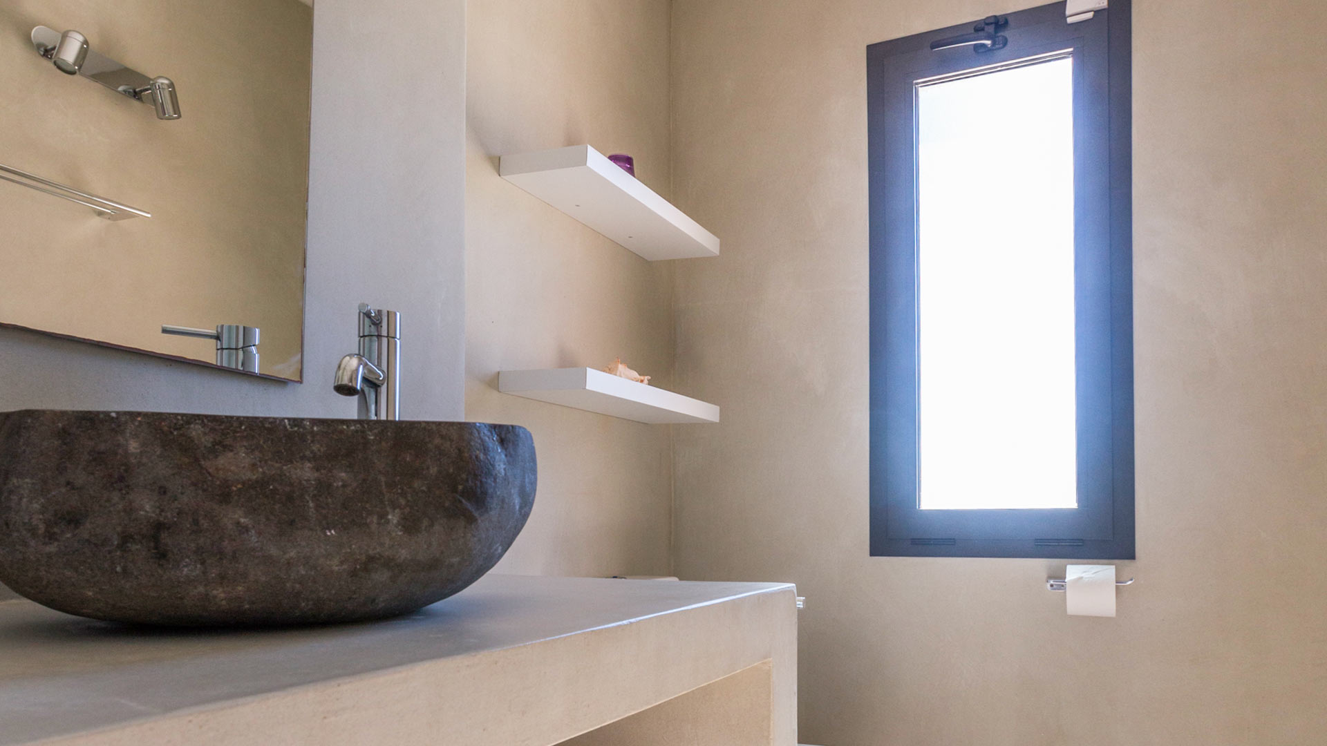 One of the basins and the incredible views from the window of Villa Tiramar in Ibiza