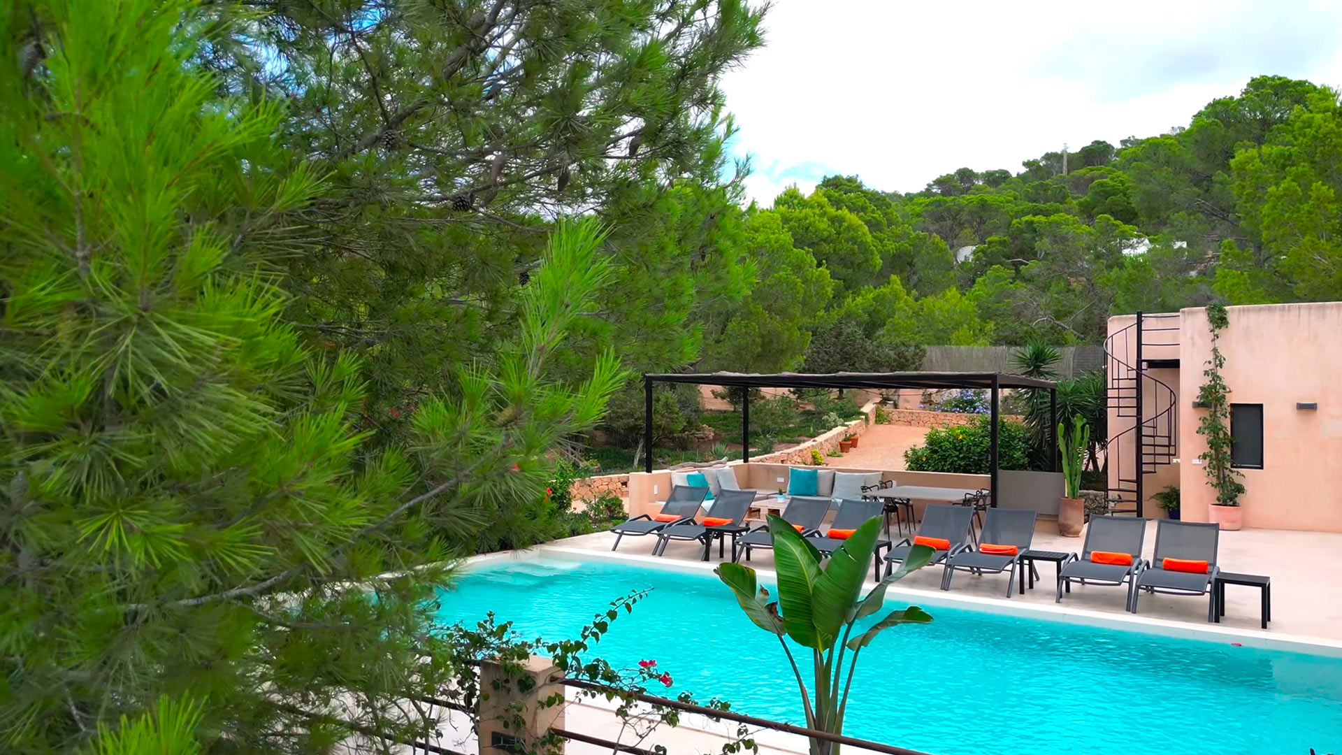Poolside view of the beautiful swimming pool at Villa Tiramar in Ibiza